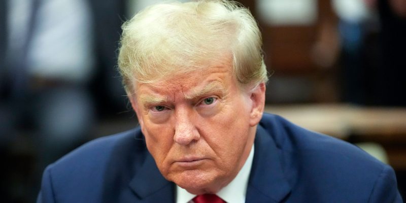 Former President Donald Trump, right, sits in the courtroom before the start of his civil business fraud trial, Wednesday, Oct. 4, 2023, at New York Supreme Court in New York. (AP Photo/Mary Altaffer, POOL)