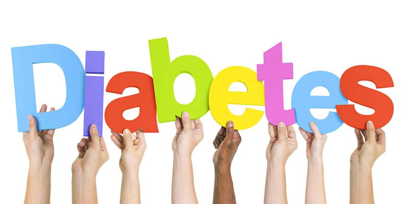 Multi-Ethnic Group Of Diverse People Holding Letters That Form Diabetes