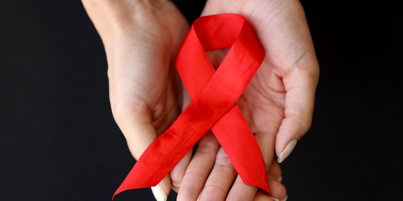 Laço Vermelho, símbolo internacional da consciência sobre o HIV e a aids.